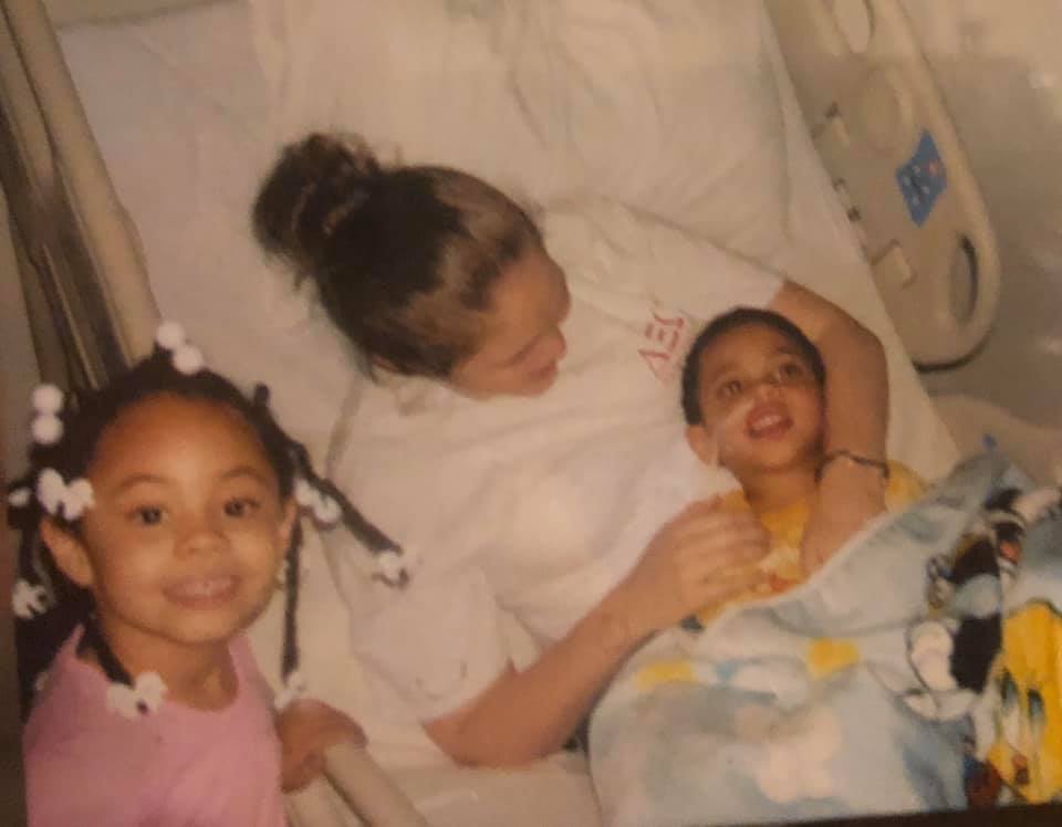 Taken in April 2005 at Scottish Rite Hospital in CRIB Unit Damien in hospital bed with his oldest sister holding him and his other sister smiling. JMorris Travel